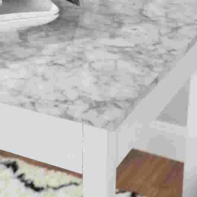 Close-up of a faux marble tabletop with white frame.