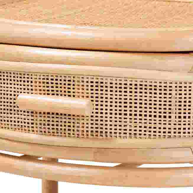 Close-up of the rattan drawer front and handle.