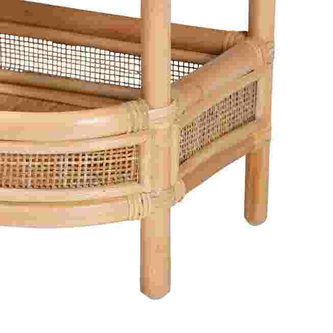 Close-up of the rattan base and leg of the nightstand.