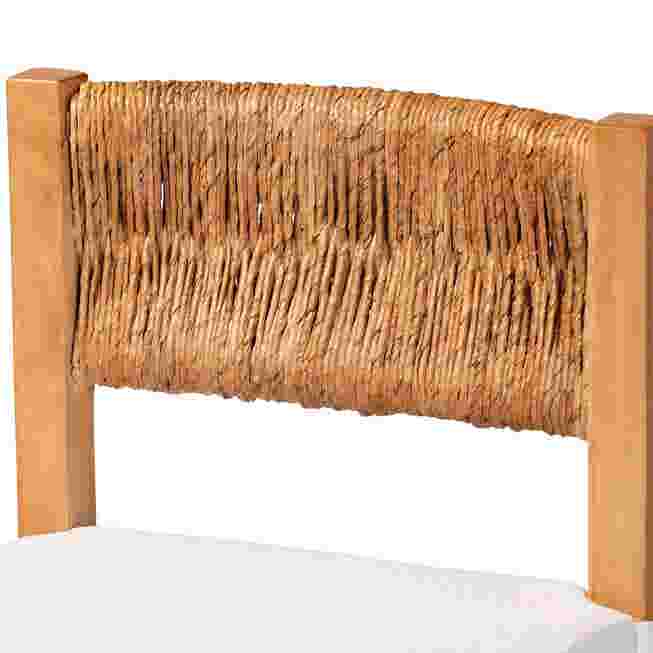 Close-up of woven seagrass backrest on counter stool with wood frame.