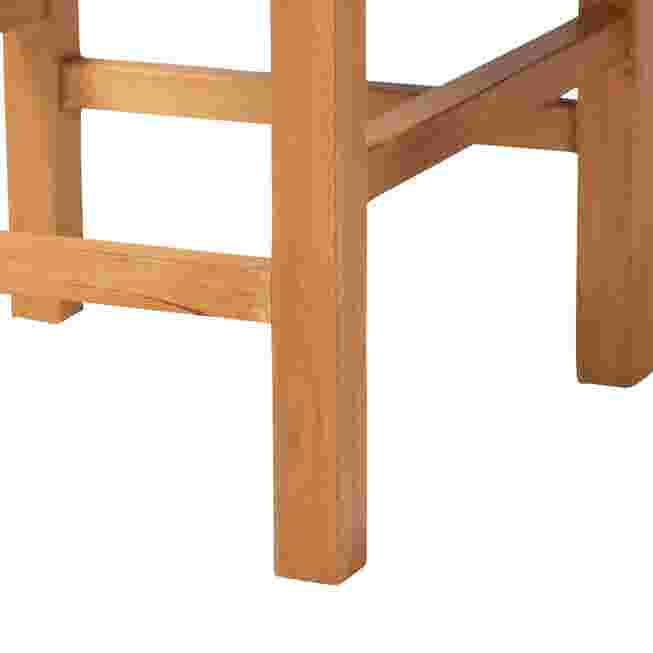 Close-up of woven seagrass counter stool legs and lower frame.