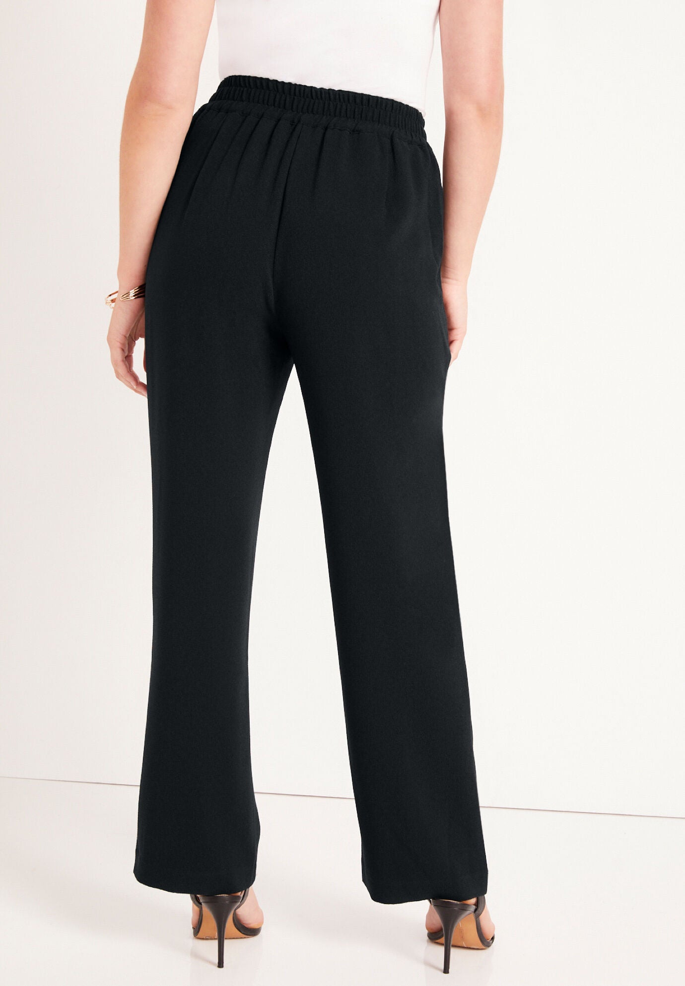 Woman within shop dress pants
