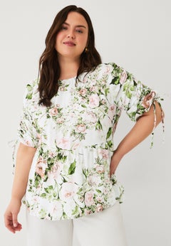 Peplum Tunic With Convertible Sleeves